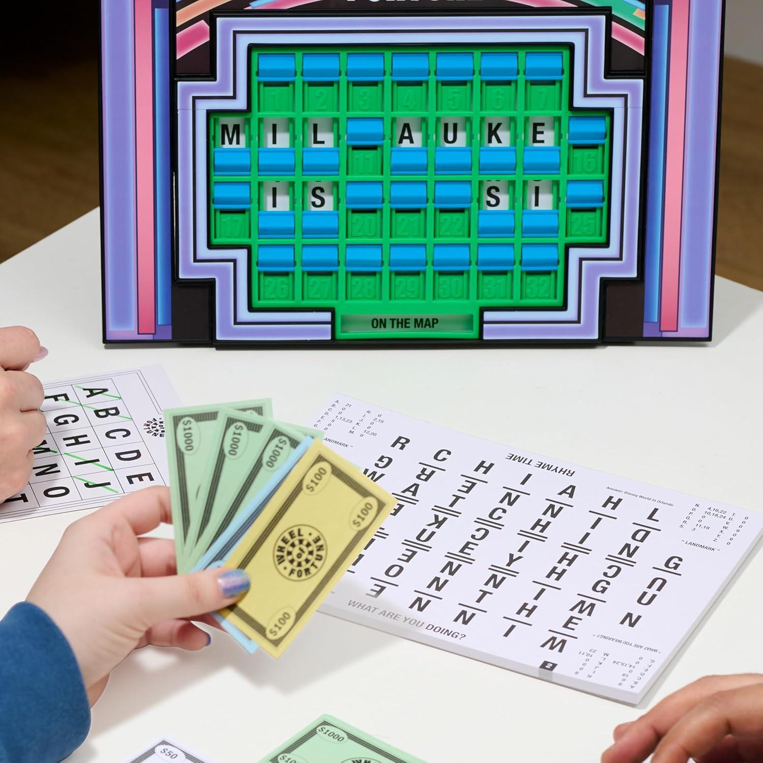 imageWheel of Fortune Deluxe Game 100 Puzzles Included Inspired by The Popular Show Interactive Puzzle Board Spin Guess Solve 24 Players Ages 10 and Up by Just Play