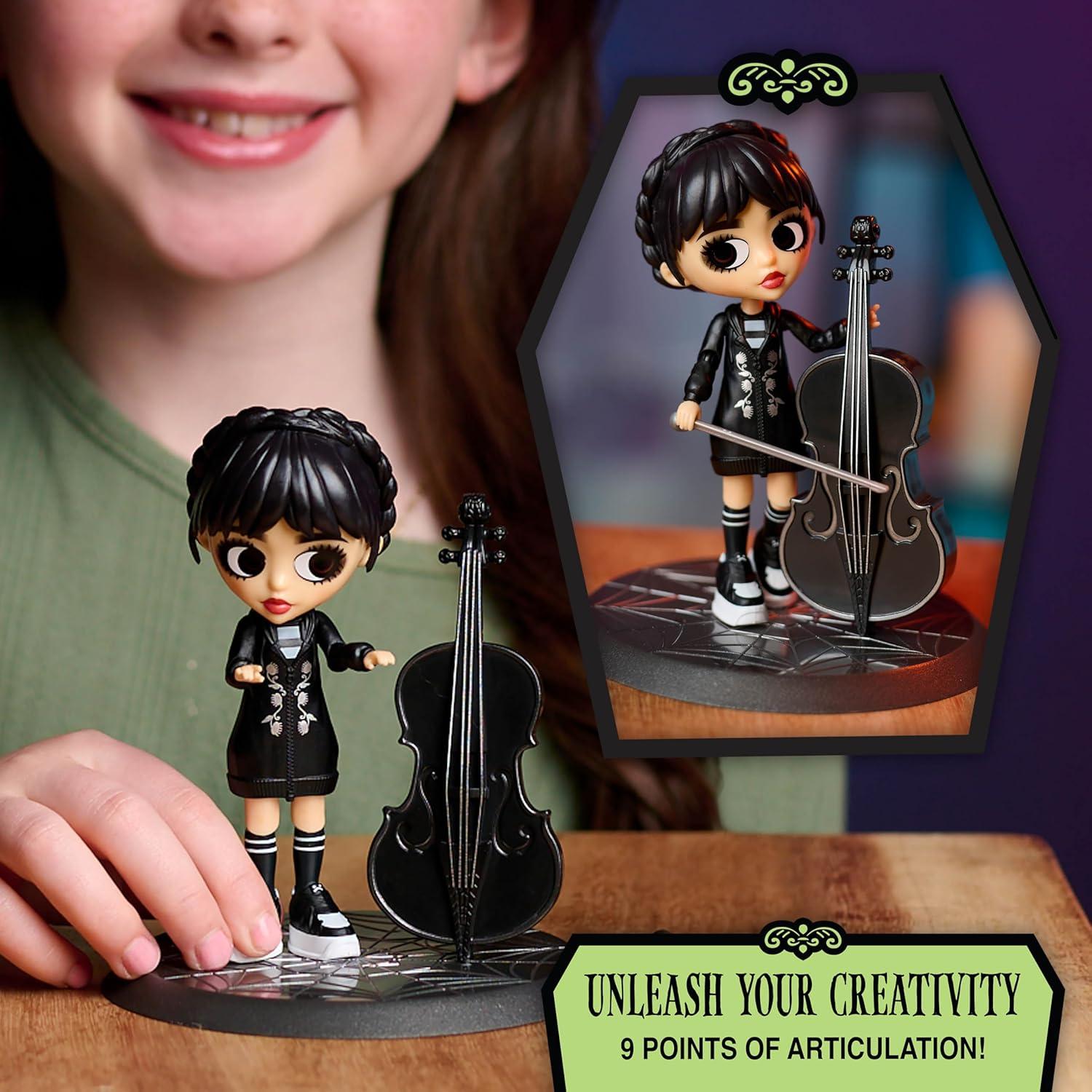 imageWEDNESDAY Deluxe 6inch Articulated Figure 11Pieces Interchangeable Face Plates and Fashion Customizable Collectible Figurine Kids Toys for Ages 3 Up by Just Play